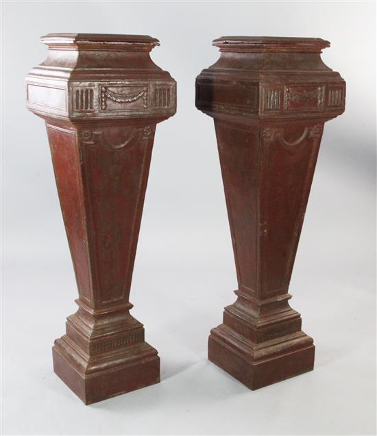 A pair of painted cast iron Adams style pedestals, H.3ft 11in.